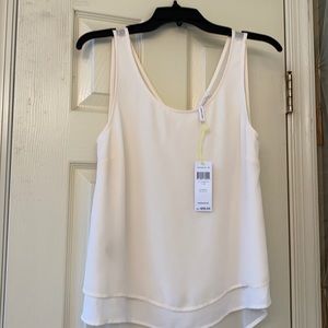 Sleeveless cream blouse